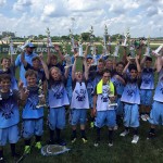 No less impressive was the local OC Warriors 9-10C team, which also won their division championship at Lax Splash last weekend. Pictured above, the Warriors celebrate after winning the title game. Submitted photo 