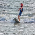 A volunteers with Surfers Healing got creative with showing this young girl the joy of surfing.